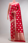Pure Silk Red Banarasi Saree with Zari Butta on the body and Zari Border.  displayed on a mannequin