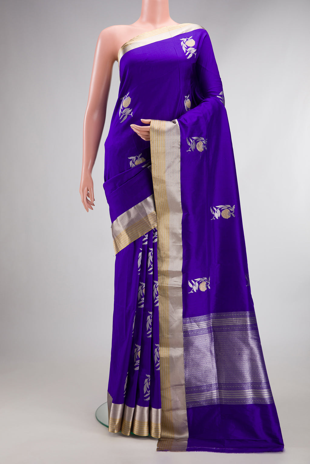 Pure Silk Royal Blue Banarasi Saree with Zari Butta on the body and Zari Border.  displayed on a mannequin