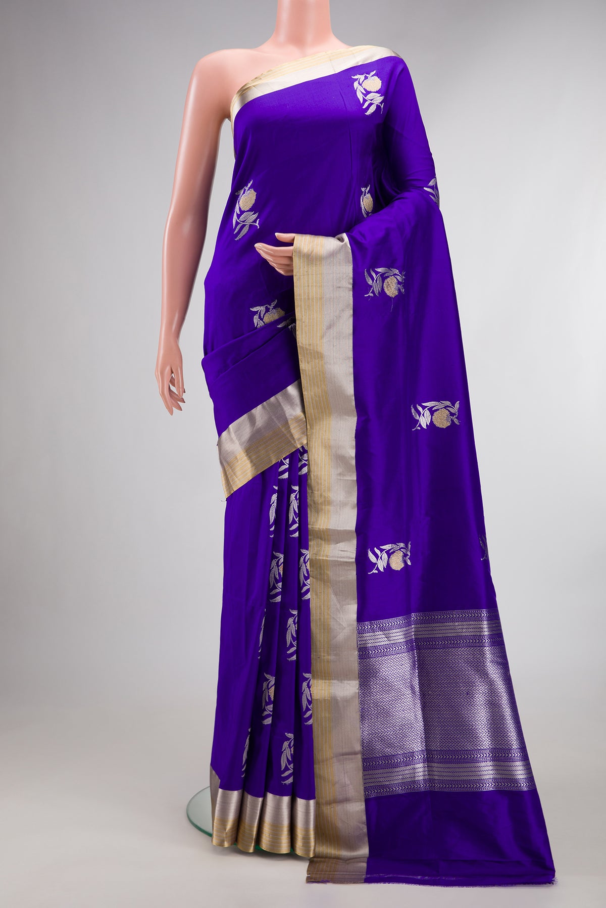 Pure Silk Royal Blue Banarasi Saree with Zari Butta on the body and Zari Border.  displayed on a mannequin