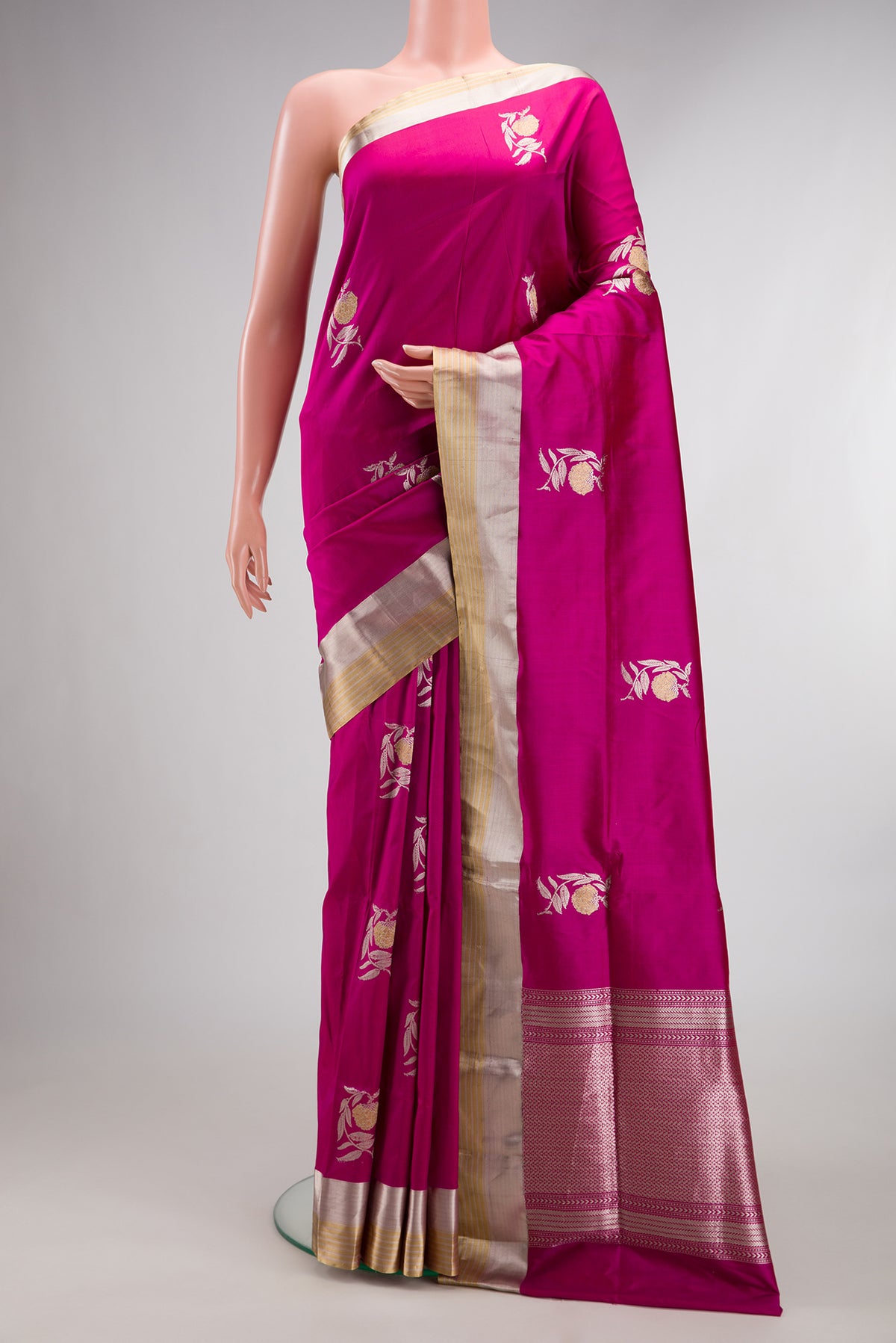 Pure Silk Magenta Dual Tone Banarasi Saree with Zari Butta on the body and Zari Border.  displayed on a mannequin