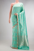 Pure Silk Sea Green Banarasi Saree with Zari Brocade on the body and Zari Border.  displayed on a mannequin
