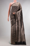 Pure Silk Black Banarasi Saree with Zari Brocade on the body and Zari Border.  displayed on a mannequin