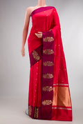 Pure Silk Red Banarasi Saree with Zari Butta on the body and Fancy Border.  displayed on a mannequin