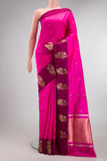 Pure Silk Dark Pink Banarasi Saree with Zari Butta on the body and Fancy Border.  displayed on a mannequin