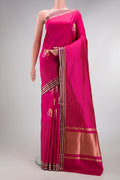 Pure Silk Dark Pink Dual Tone Banarasi Saree with Zari Butta on the body and Fancy Border.  displayed on a mannequin