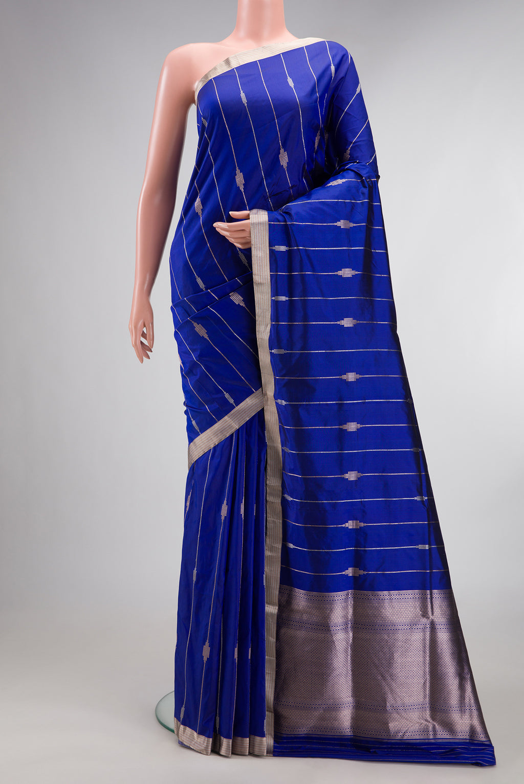 Pure Silk Royal Blue Dual Tone Banarasi Saree with Stripes on the body and Zari Border.  displayed on a mannequin