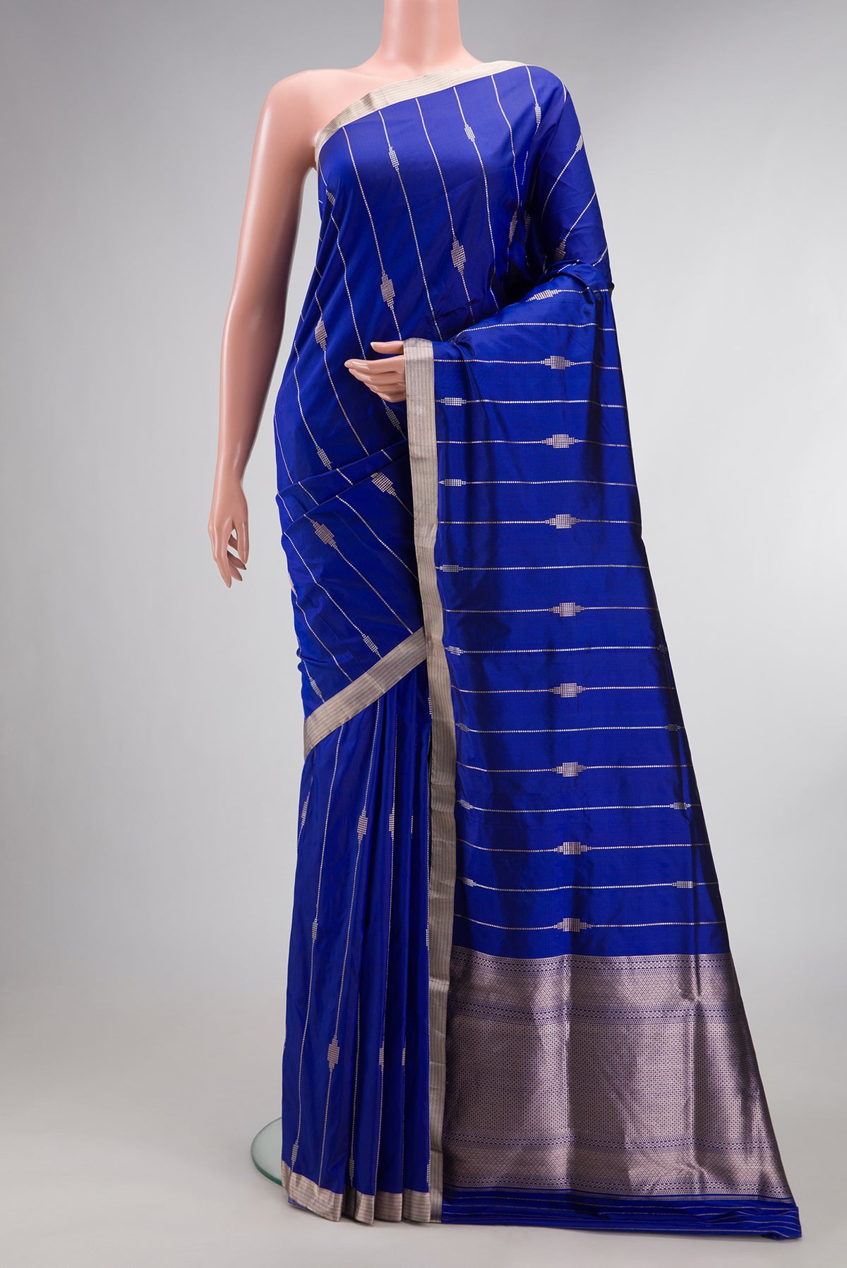 Pure Silk Royal Blue Dual Tone Banarasi Saree with Stripes on the body and Zari Border.  displayed on a mannequin