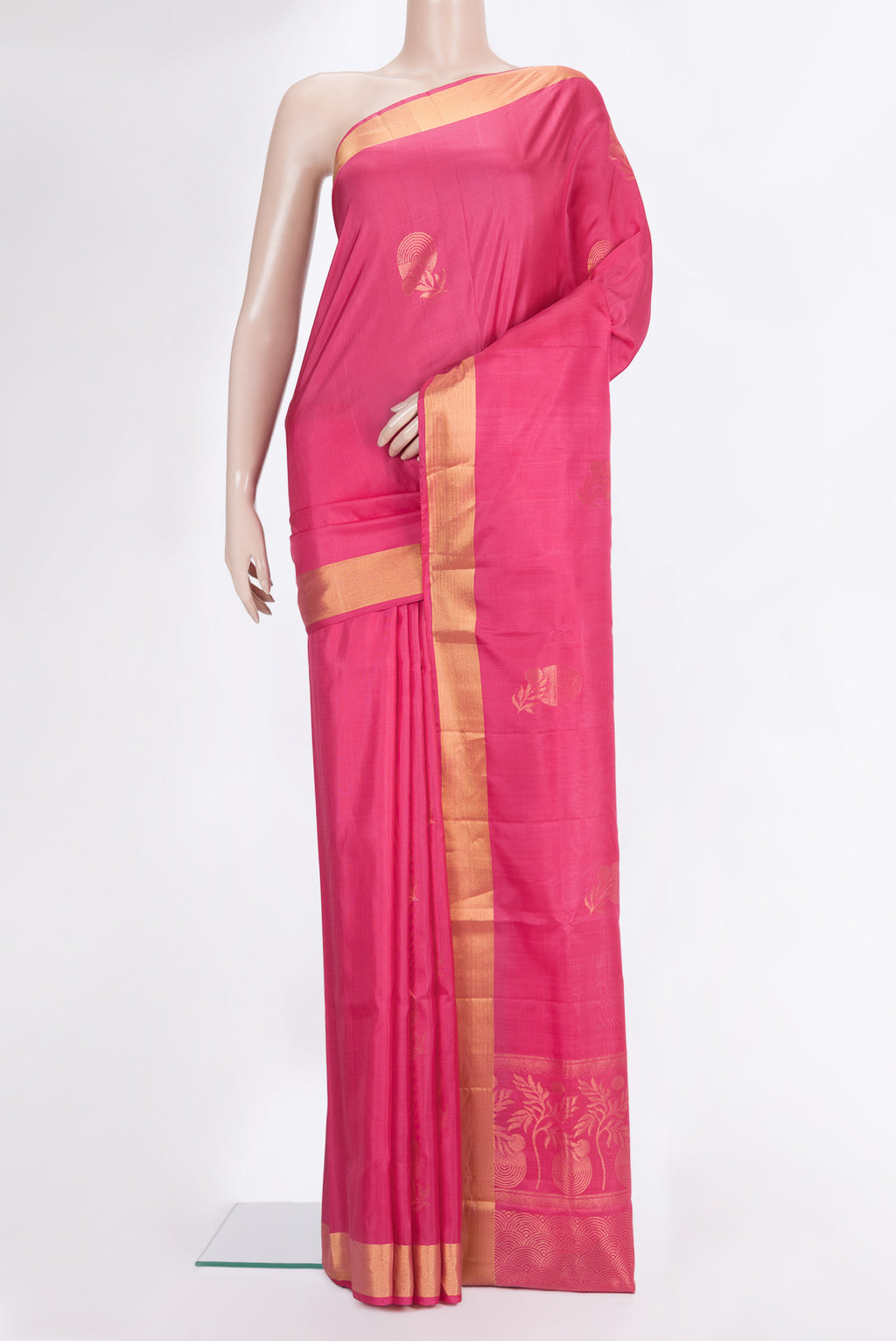 Pure Silk Pink Soft Saree with Zari Butta on the body and Zari Border.  displayed on a mannequin