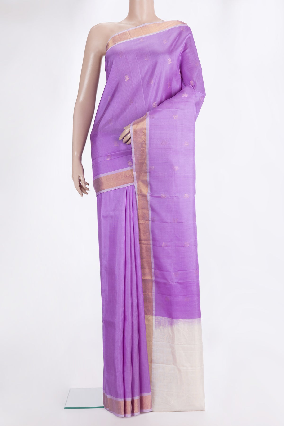 Pure Silk Lavender Soft Saree with Zari Butta on the body and Zari Border.  displayed on a mannequin