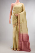 Pure Silk Sandal Soft Saree with Zari Butta on the body and Zari Border.  displayed on a mannequin