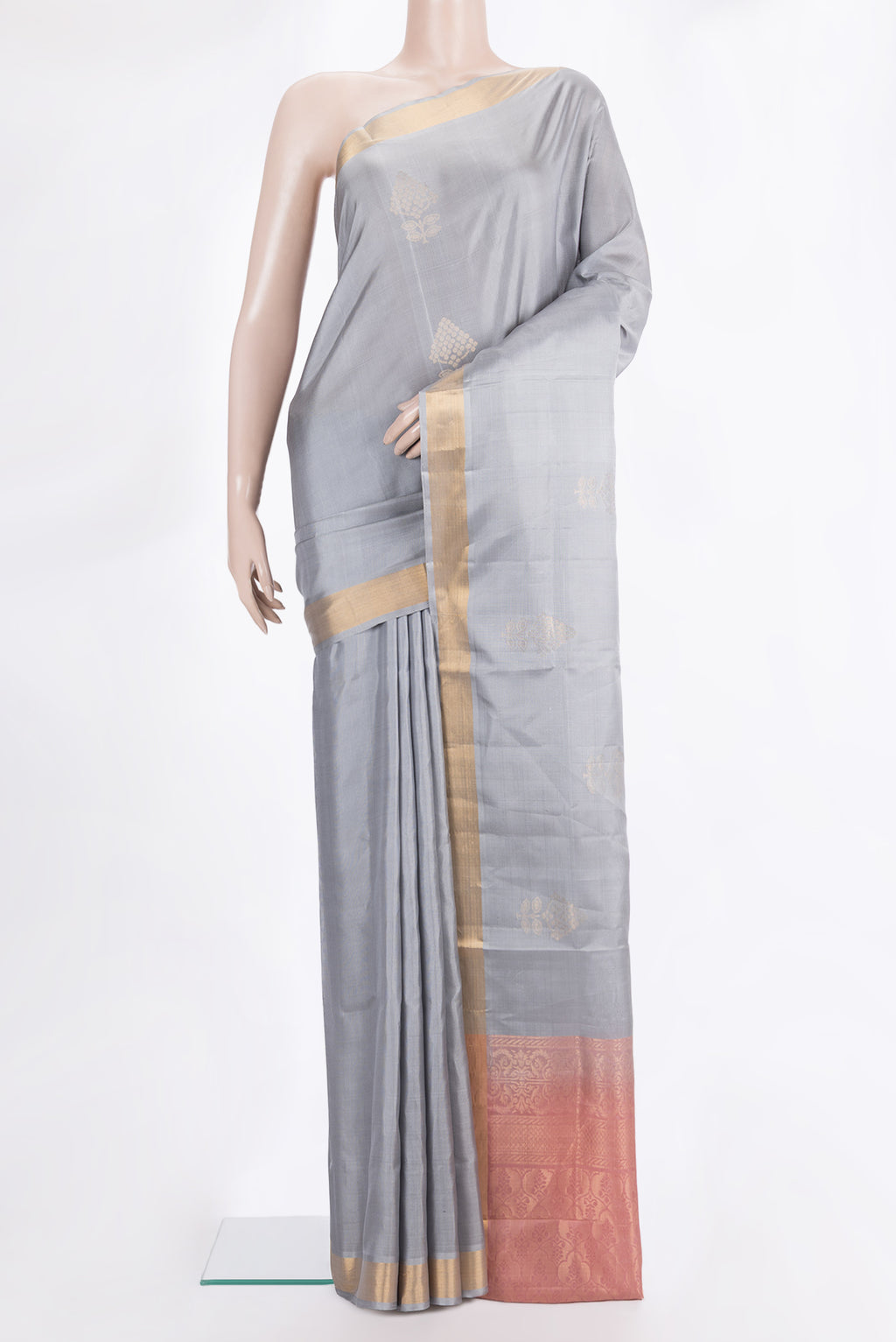 Pure Silk Grey Soft Saree with Zari Butta on the body and Zari Border.  displayed on a mannequin