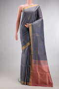 Pure Silk Grey Soft Saree with Zari Butta on the body and Zari Border.  displayed on a mannequin