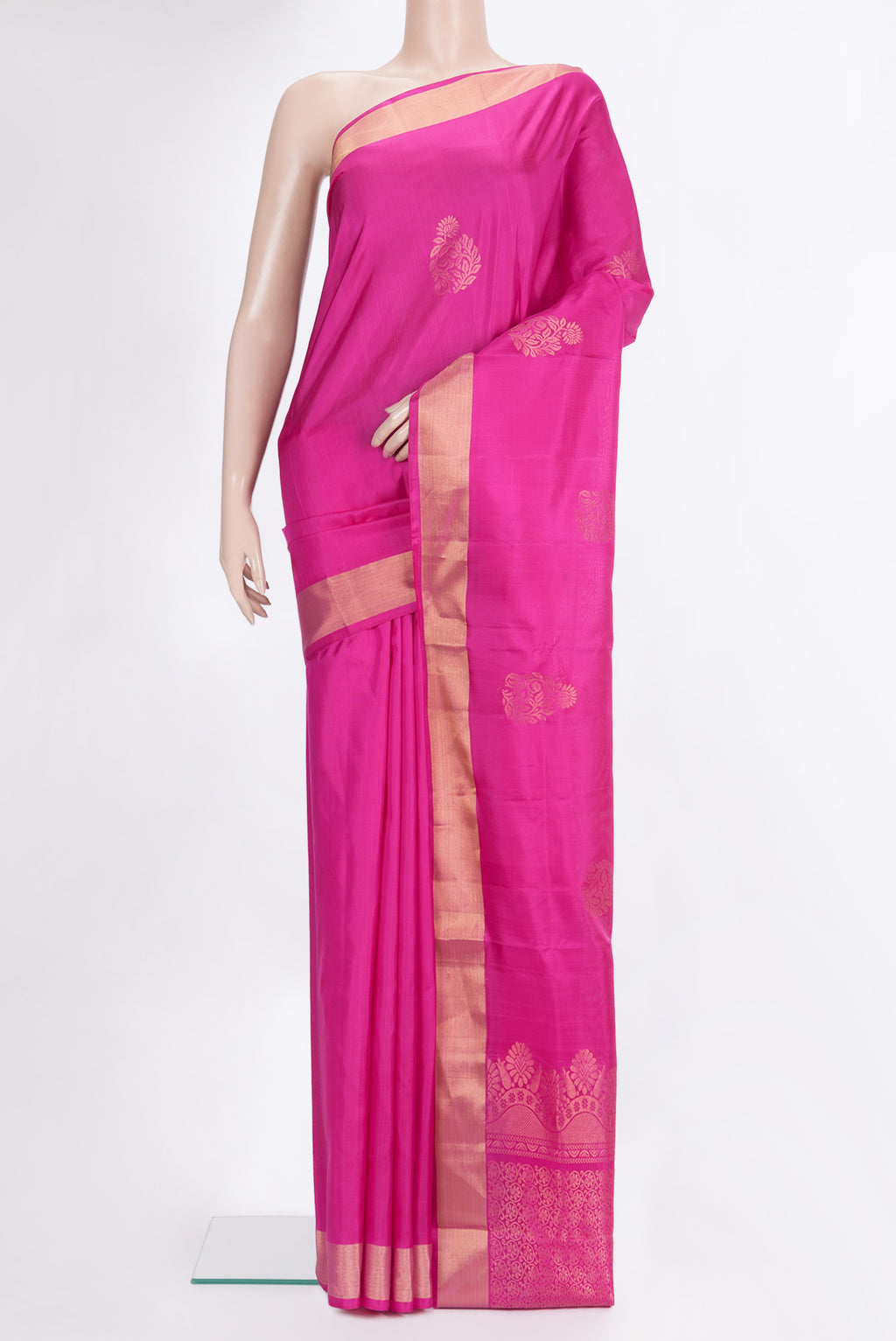 Pure Silk Dark Pink Soft Saree with Zari Butta on the body and Zari Border.  displayed on a mannequin