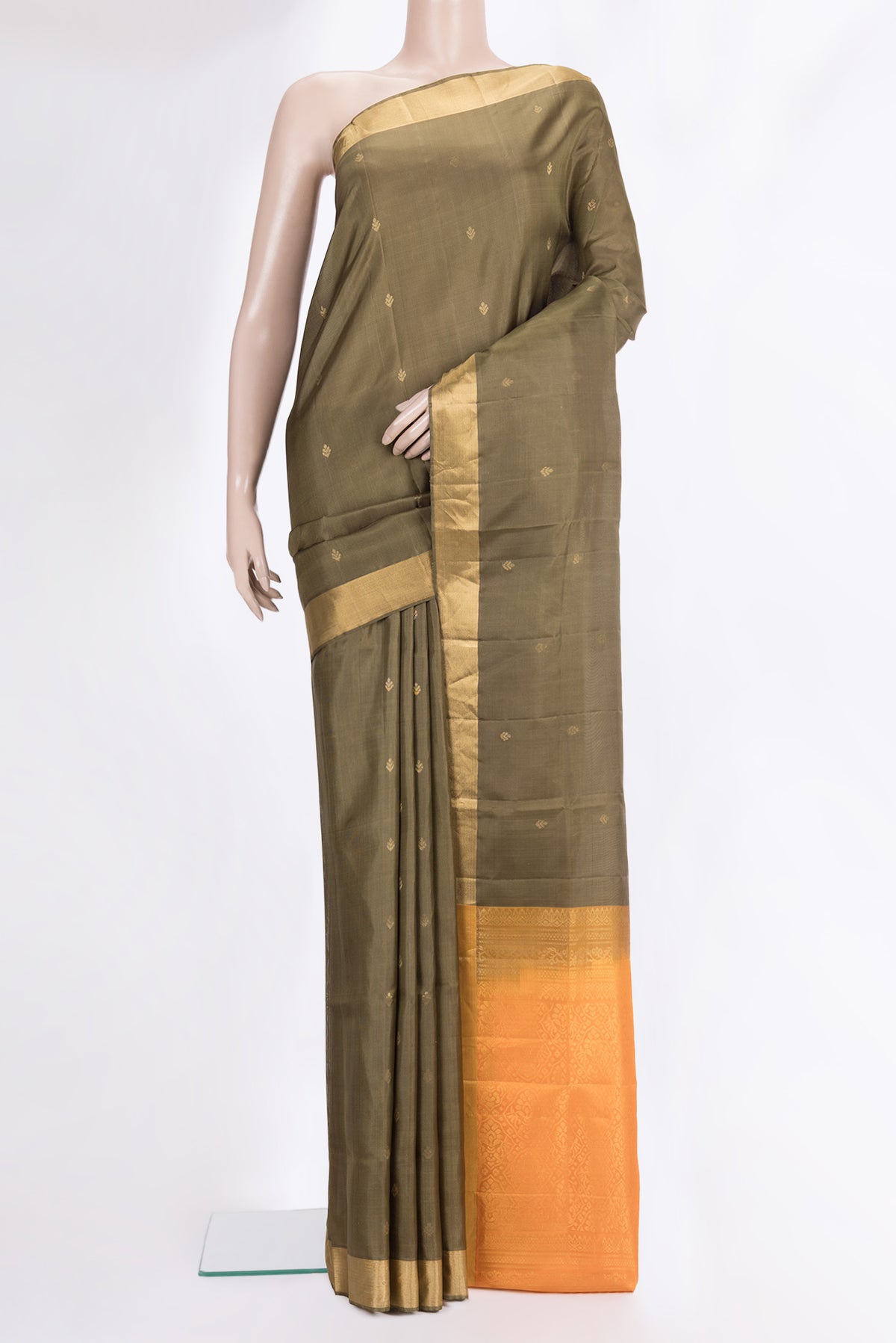 Pure Silk Brown Soft Saree with Zari Butta on the body and Zari Border.  displayed on a mannequin