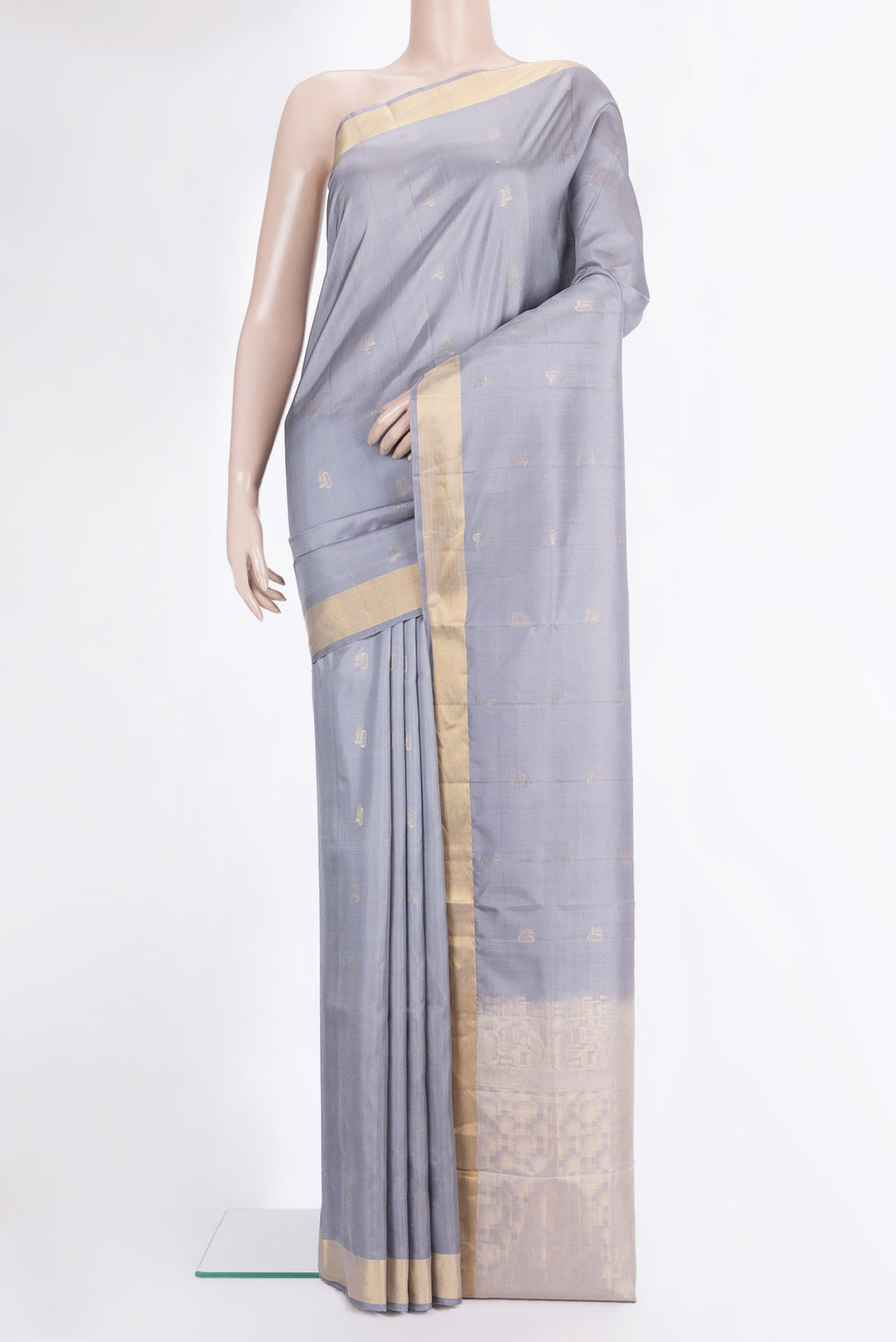 Pure Silk Grey Soft Saree with Zari Butta on the body and Zari Border.  displayed on a mannequin