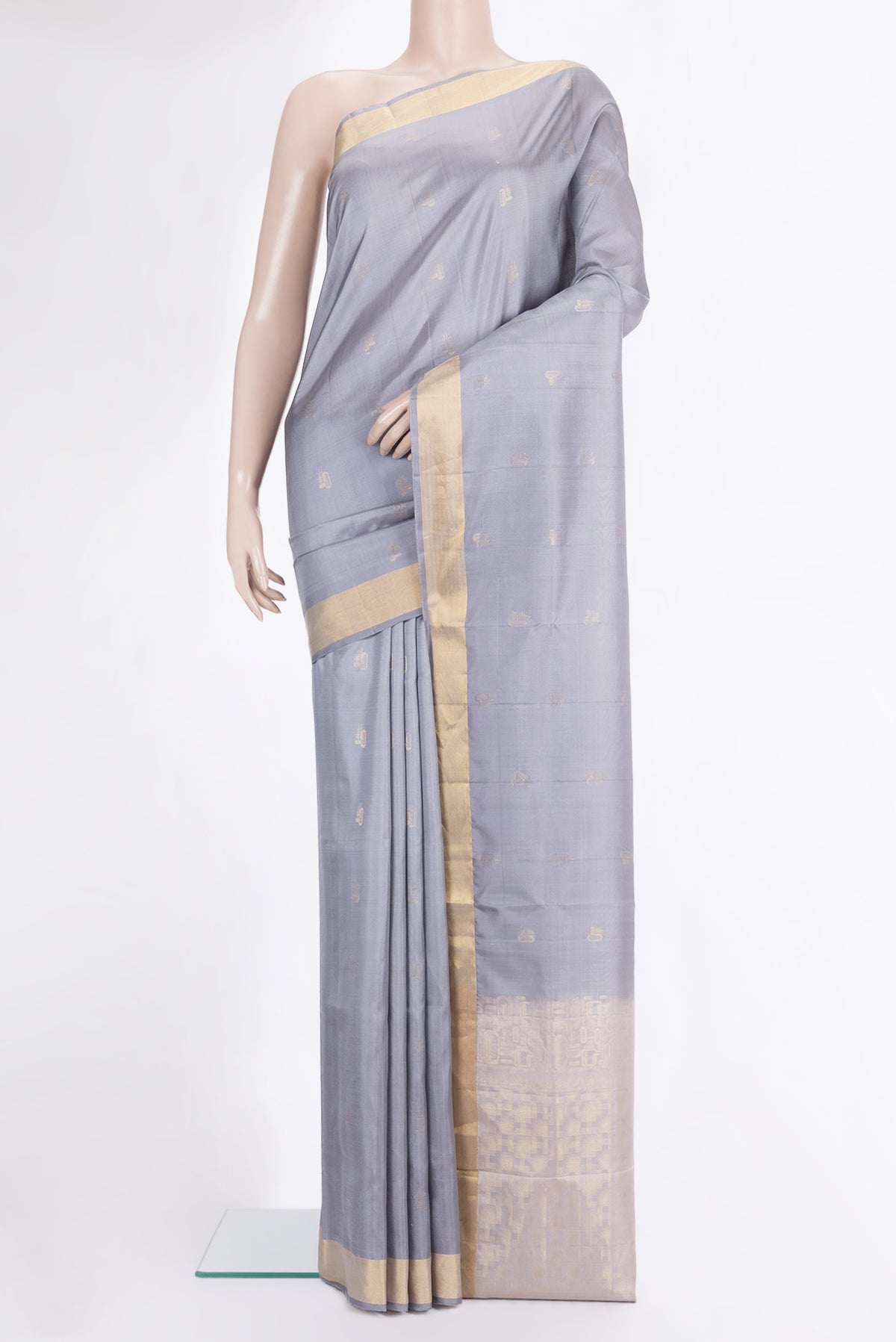 Pure Silk Grey Soft Saree with Zari Butta on the body and Zari Border.  displayed on a mannequin