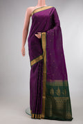 Pure Silk Purple Soft Saree with Zari Butta on the body and Zari Border.  displayed on a mannequin