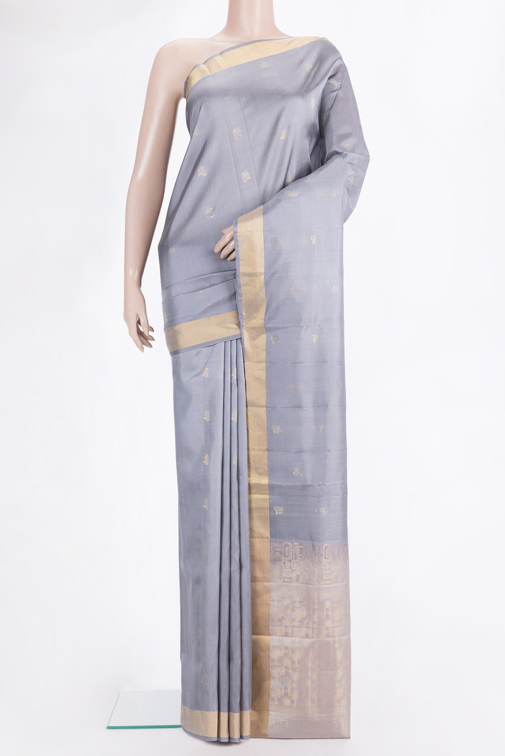 Pure Silk Grey Dual Tone Soft Saree with Zari Butta on the body and Zari Border.  displayed on a mannequin
