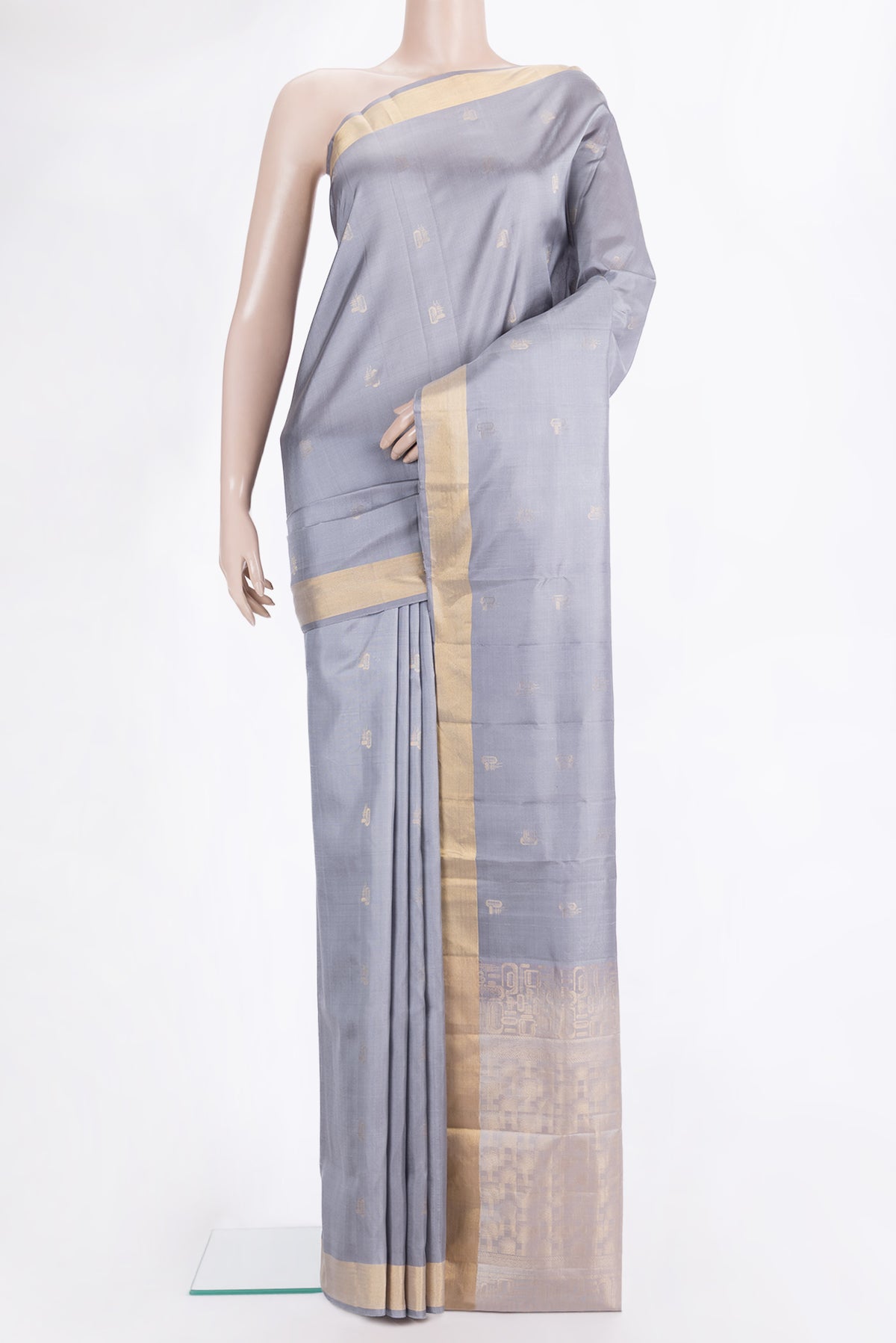 Pure Silk Grey Dual Tone Soft Saree with Zari Butta on the body and Zari Border.  displayed on a mannequin