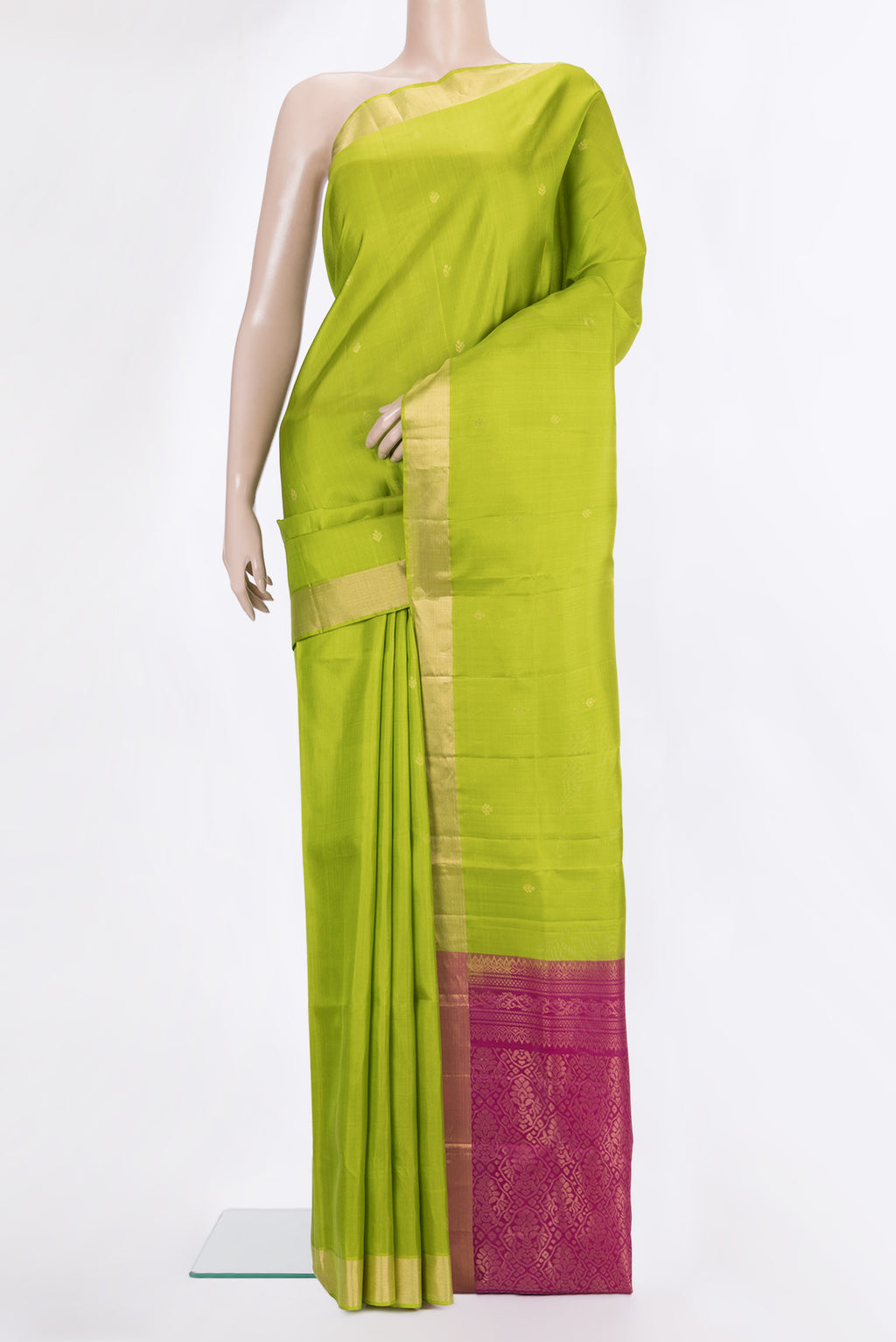 Pure Silk Parrot Green Soft Saree with Zari Butta on the body and Zari Border.  displayed on a mannequin