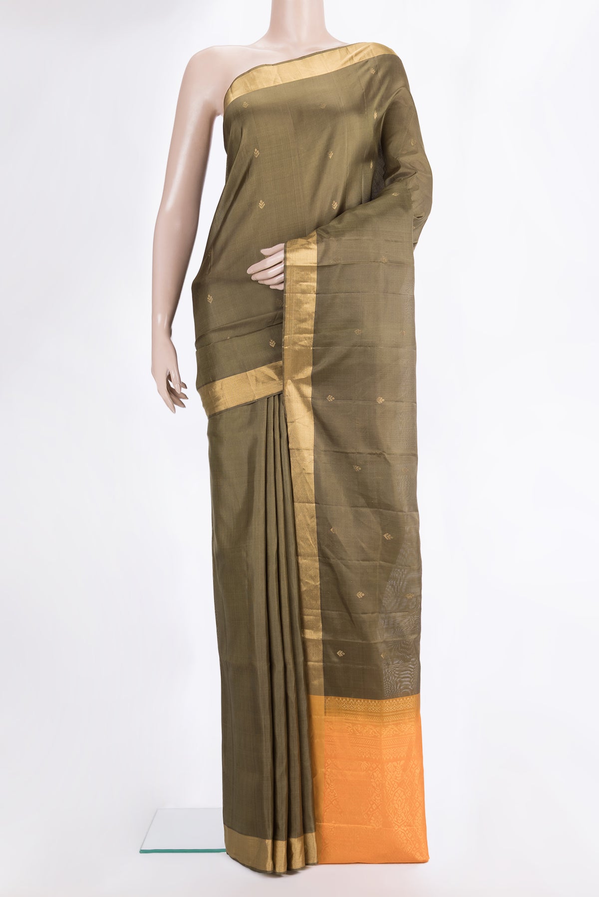 Pure Silk Mehandi Green Soft Saree with Zari Butta on the body and Zari Border.  displayed on a mannequin