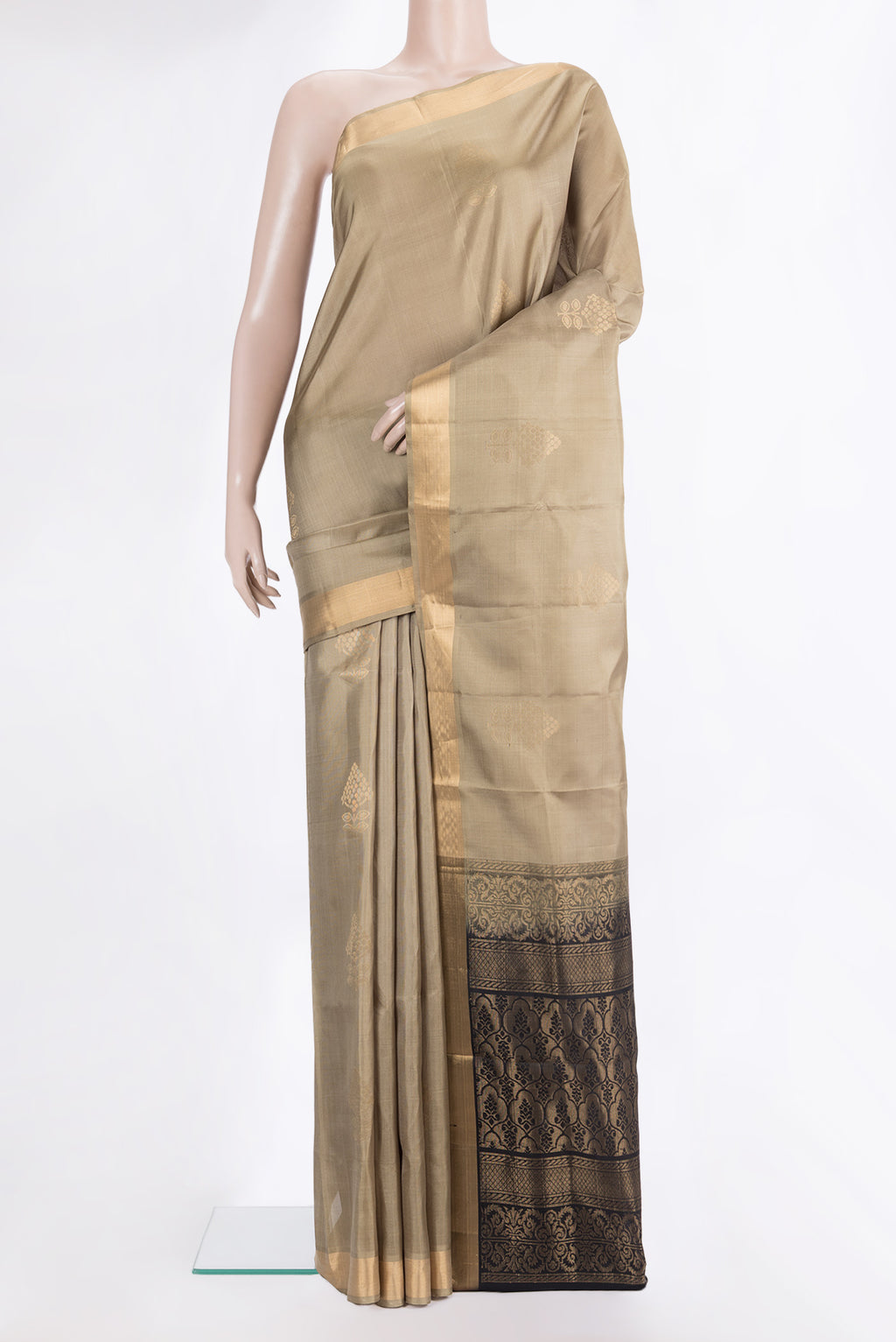 Pure Silk Beige Soft Saree with Zari Butta on the body and Zari Border.  displayed on a mannequin