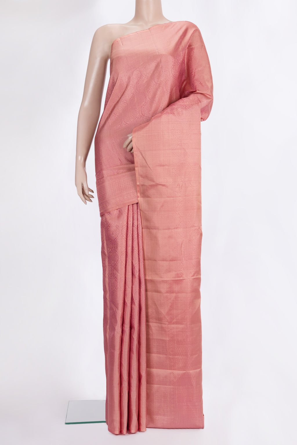 Pure Silk Coral Soft Saree with Zari Brocade on the body and Fancy Border.  displayed on a mannequin