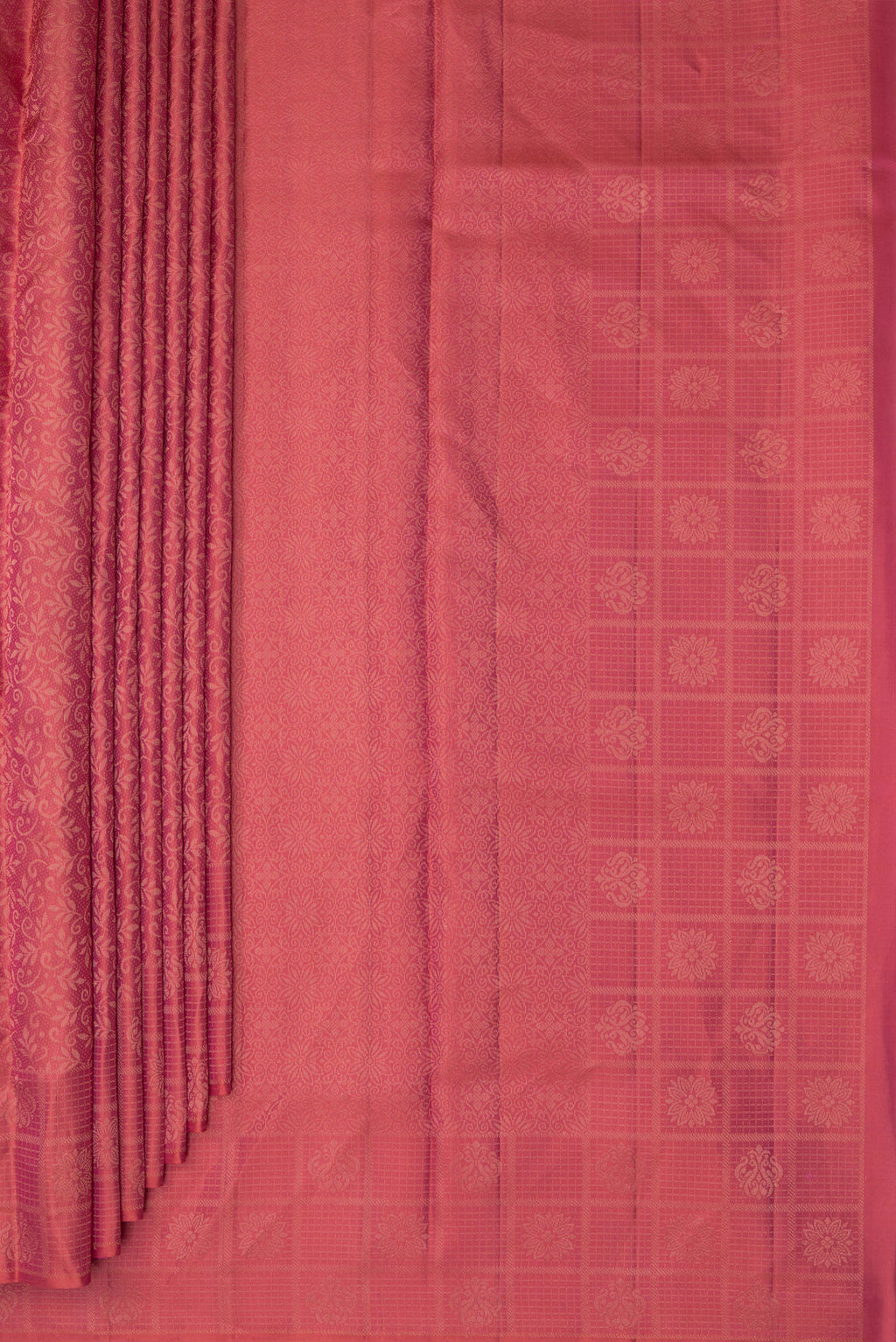 Pleats and pallu of Pure Silk Coral Soft Saree with Zari Brocade on the body and Fancy Border. 