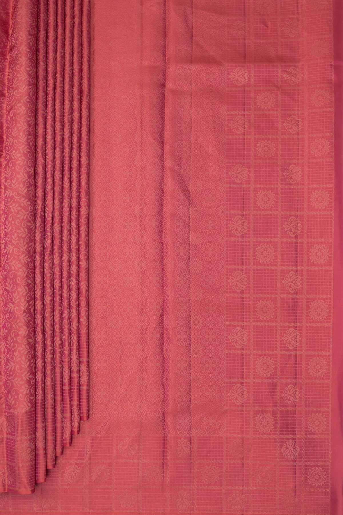 Pleats and pallu of Pure Silk Coral Soft Saree with Zari Brocade on the body and Fancy Border. 