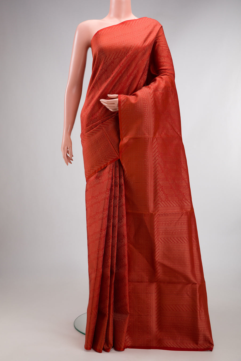 Pure Silk Orange Soft Saree with Zari Brocade on the body and Fancy Border.  displayed on a mannequin