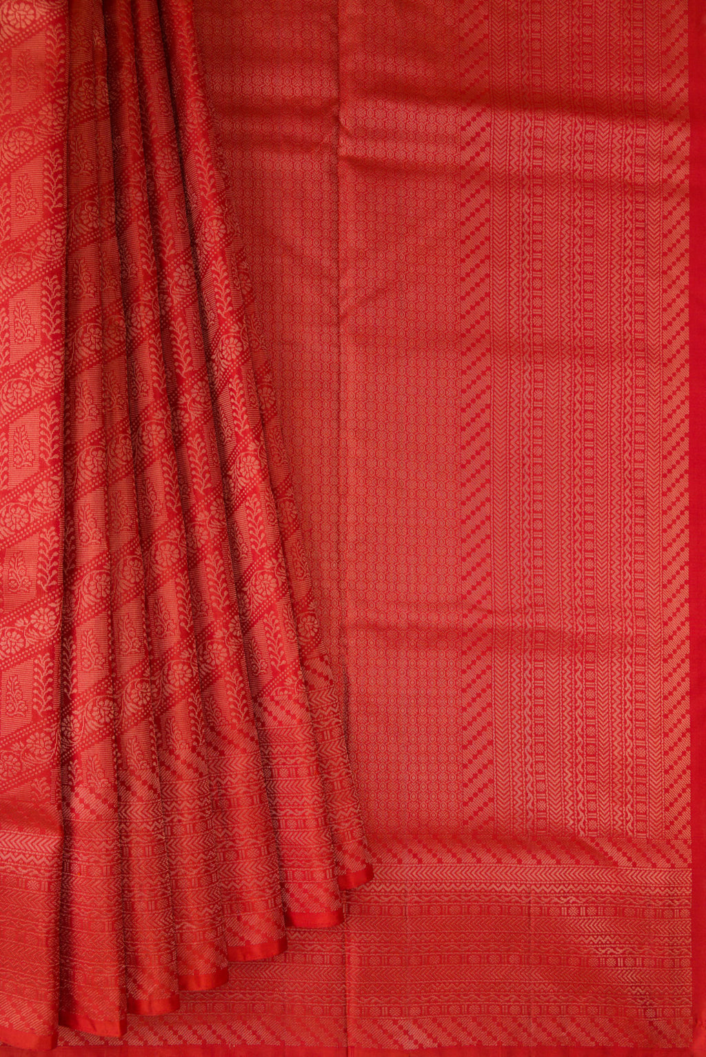 Pleats and pallu of Pure Silk Orange Soft Saree with Zari Brocade on the body and Fancy Border. 