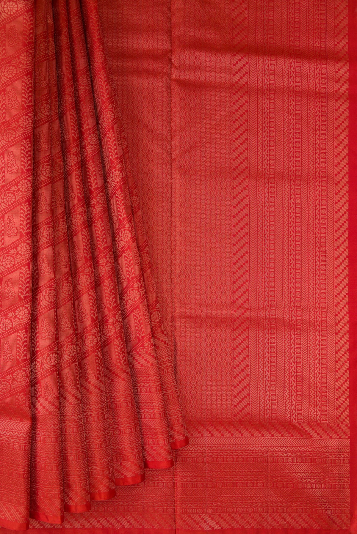 Pleats and pallu of Pure Silk Orange Soft Saree with Zari Brocade on the body and Fancy Border. 