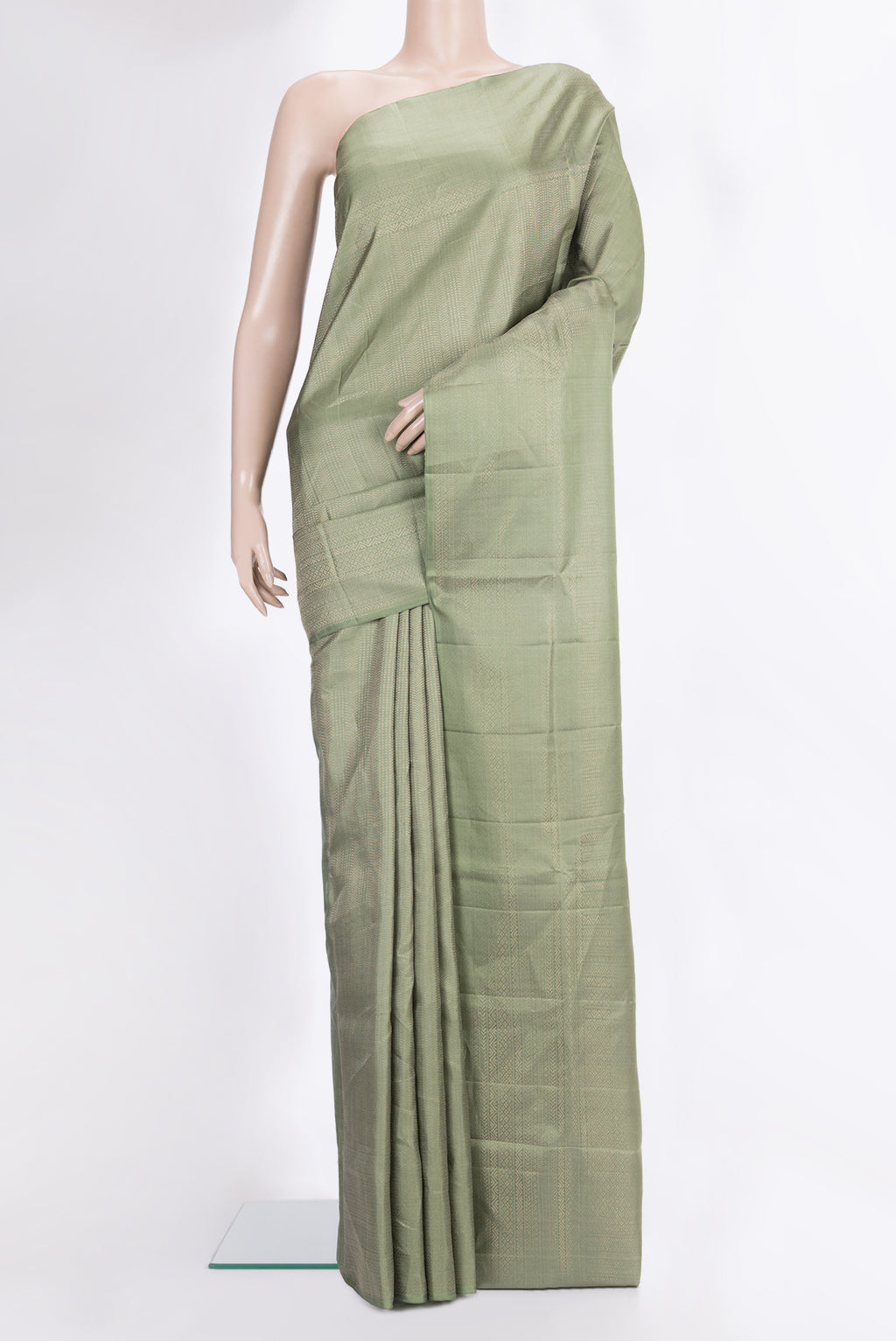 Pure Silk Sage Green Soft Saree with Zari Brocade on the body and Fancy Border.  displayed on a mannequin