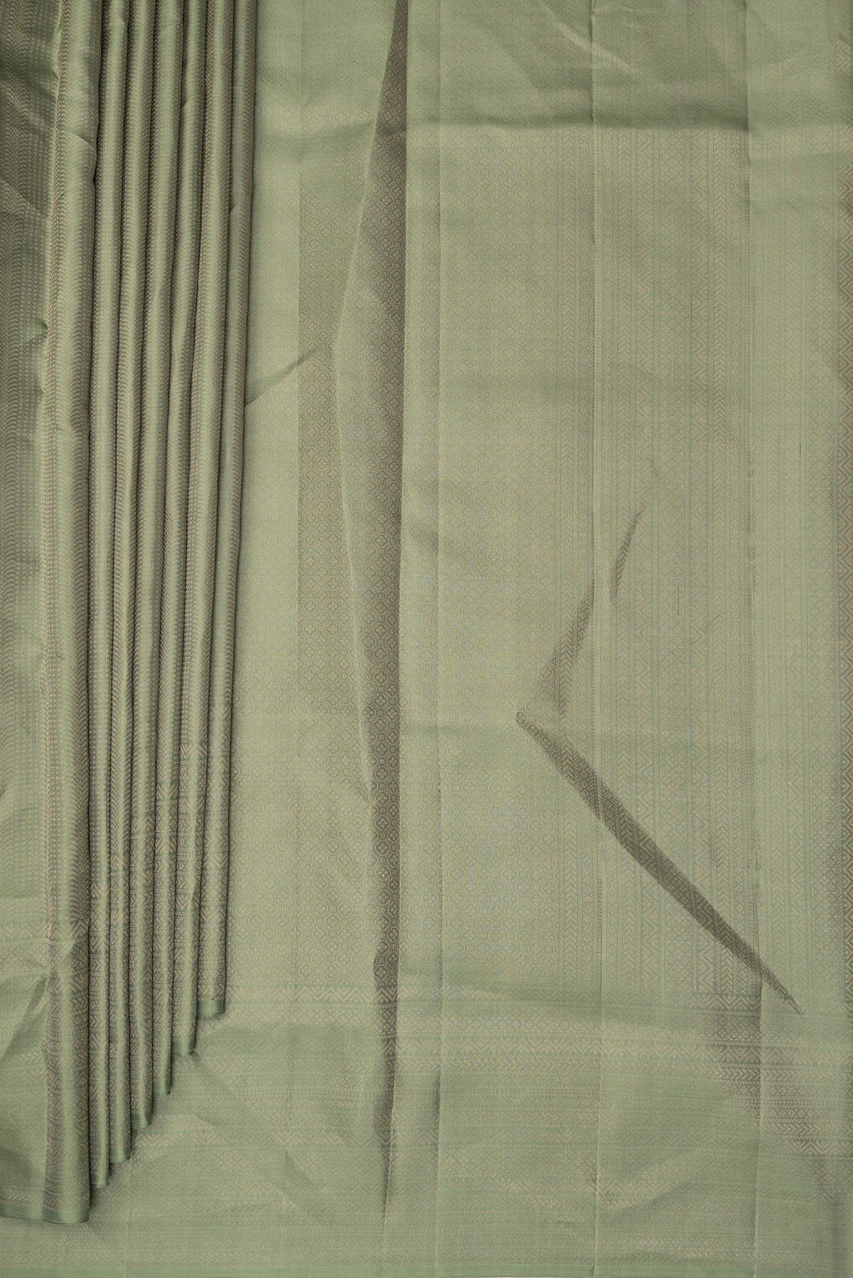 Pleats and pallu of Pure Silk Sage Green Soft Saree with Zari Brocade on the body and Fancy Border. 