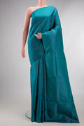 Pure Silk Peacock Blue Soft Saree with Zari Brocade on the body and Fancy Border.  displayed on a mannequin
