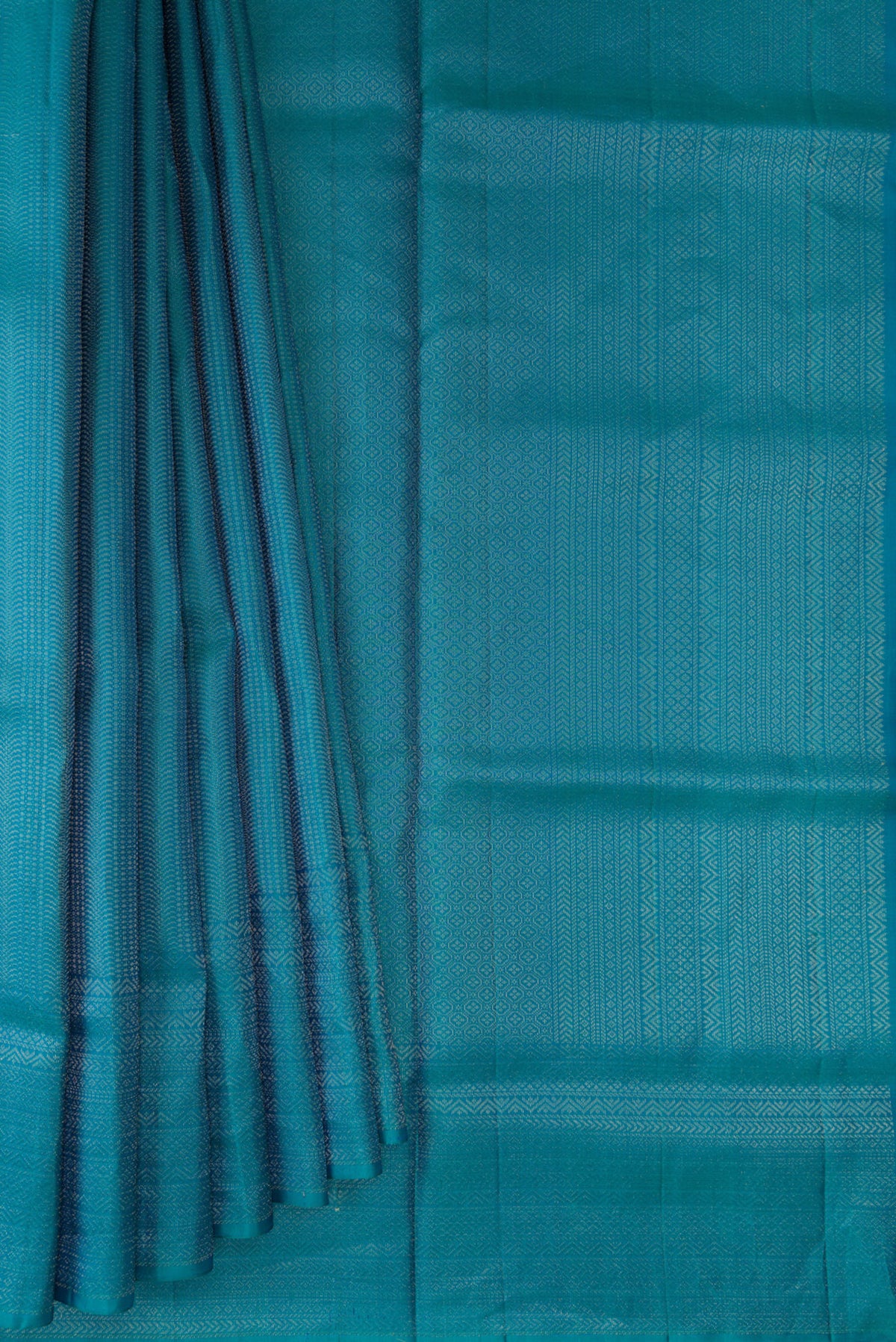 Pleats and pallu of Pure Silk Peacock Blue Soft Saree with Zari Brocade on the body and Fancy Border. 