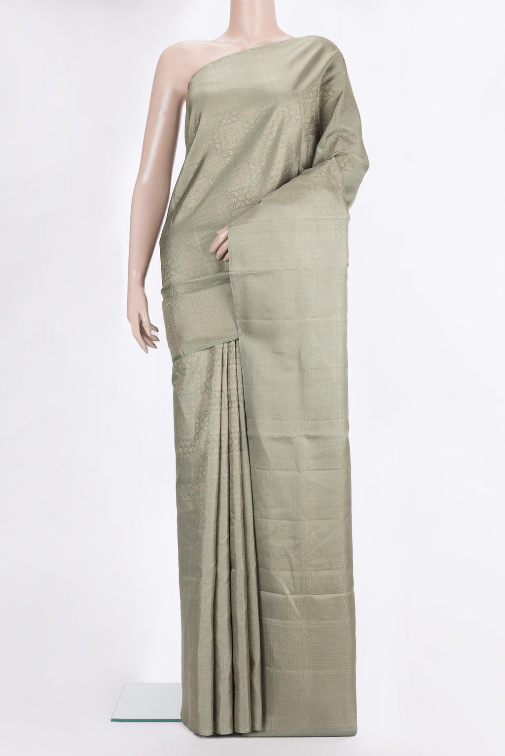 Pure Silk Sage Green Soft Saree with Zari Brocade on the body and Fancy Border.  displayed on a mannequin