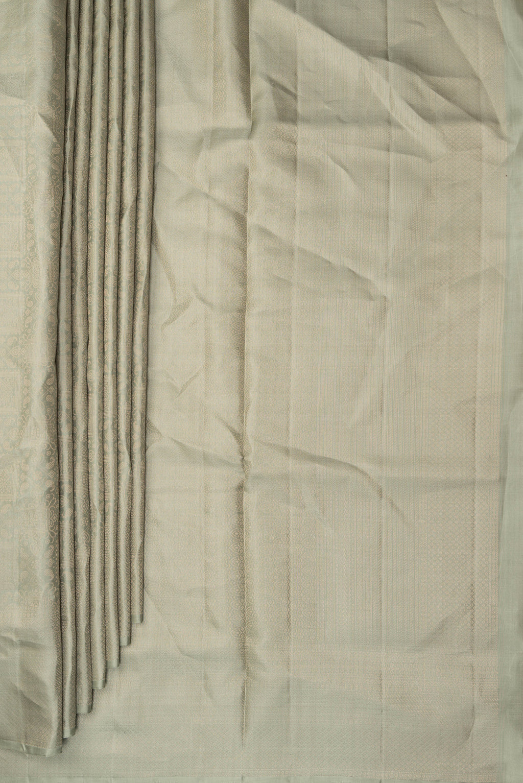 Pleats and pallu of Pure Silk Sage Green Soft Saree with Zari Brocade on the body and Fancy Border. 