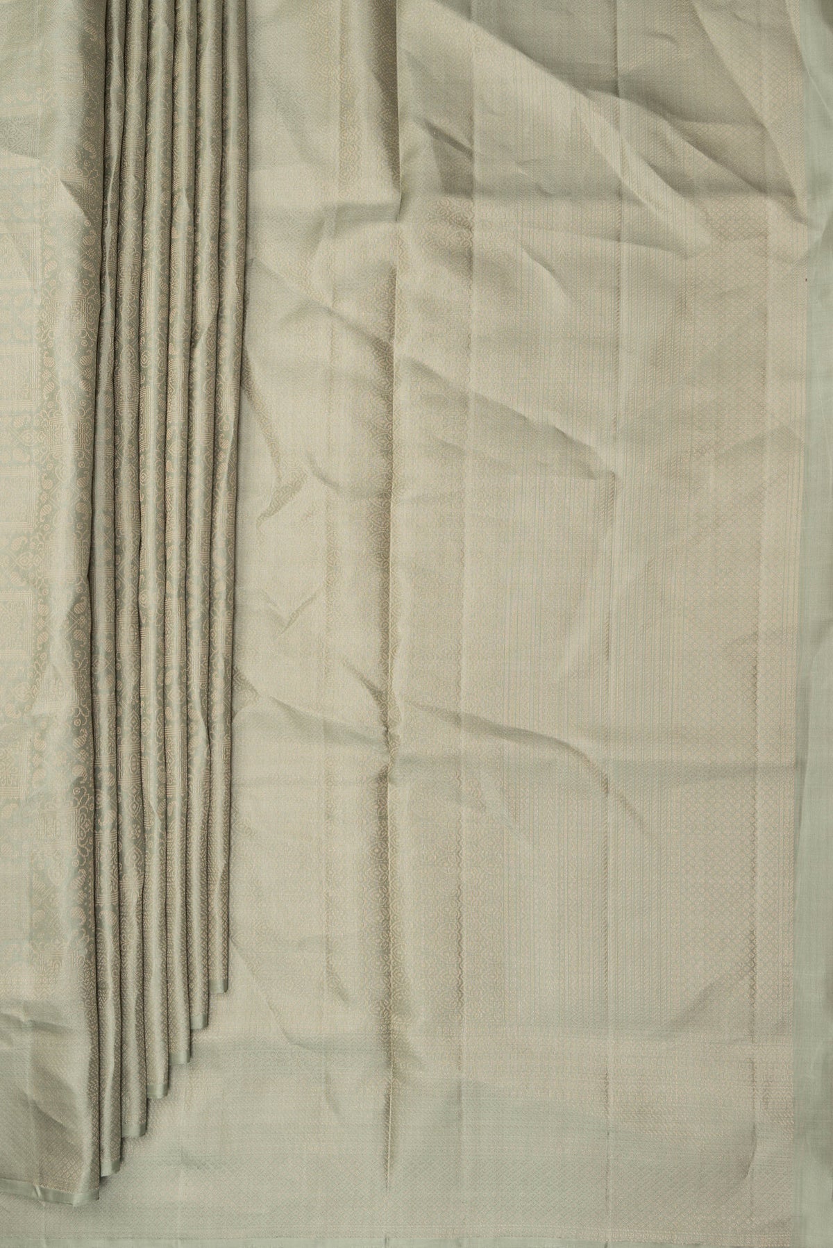 Pleats and pallu of Pure Silk Sage Green Soft Saree with Zari Brocade on the body and Fancy Border. 