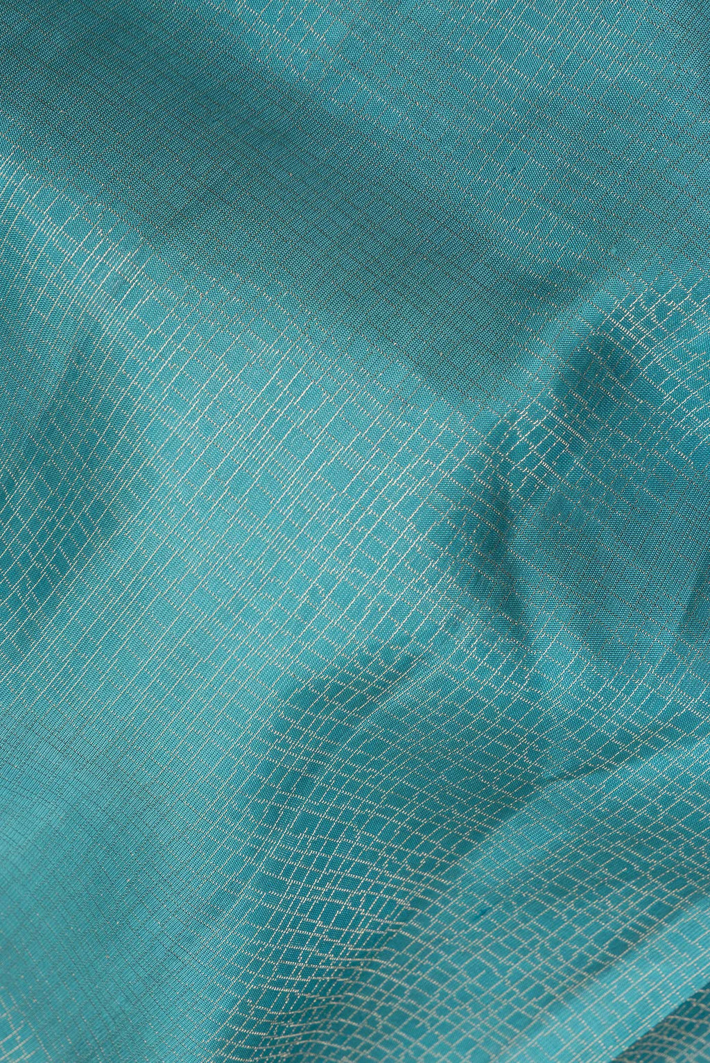 Close up of Pure Silk Sky Blue Soft Saree with Zari Brocade on the body and Fancy Border.  displaying folds