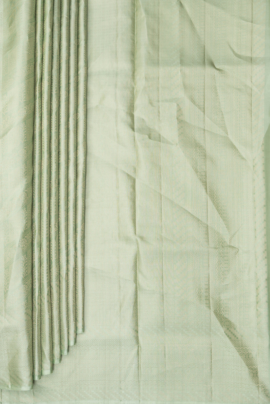Pleats and pallu of Pure Silk Pista Green Soft Saree with Zari Brocade on the body and Fancy Border. 