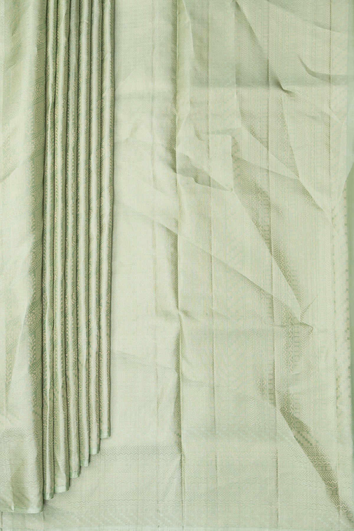 Pleats and pallu of Pure Silk Pista Green Soft Saree with Zari Brocade on the body and Fancy Border. 