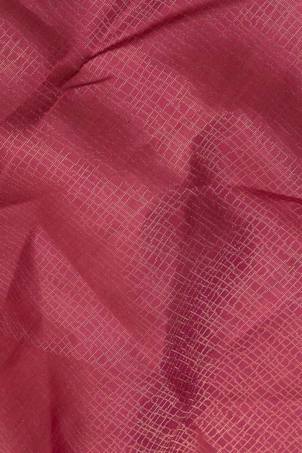 Close up of Pure Silk Coral Soft Saree with Zari Brocade on the body and Fancy Border.  displaying folds