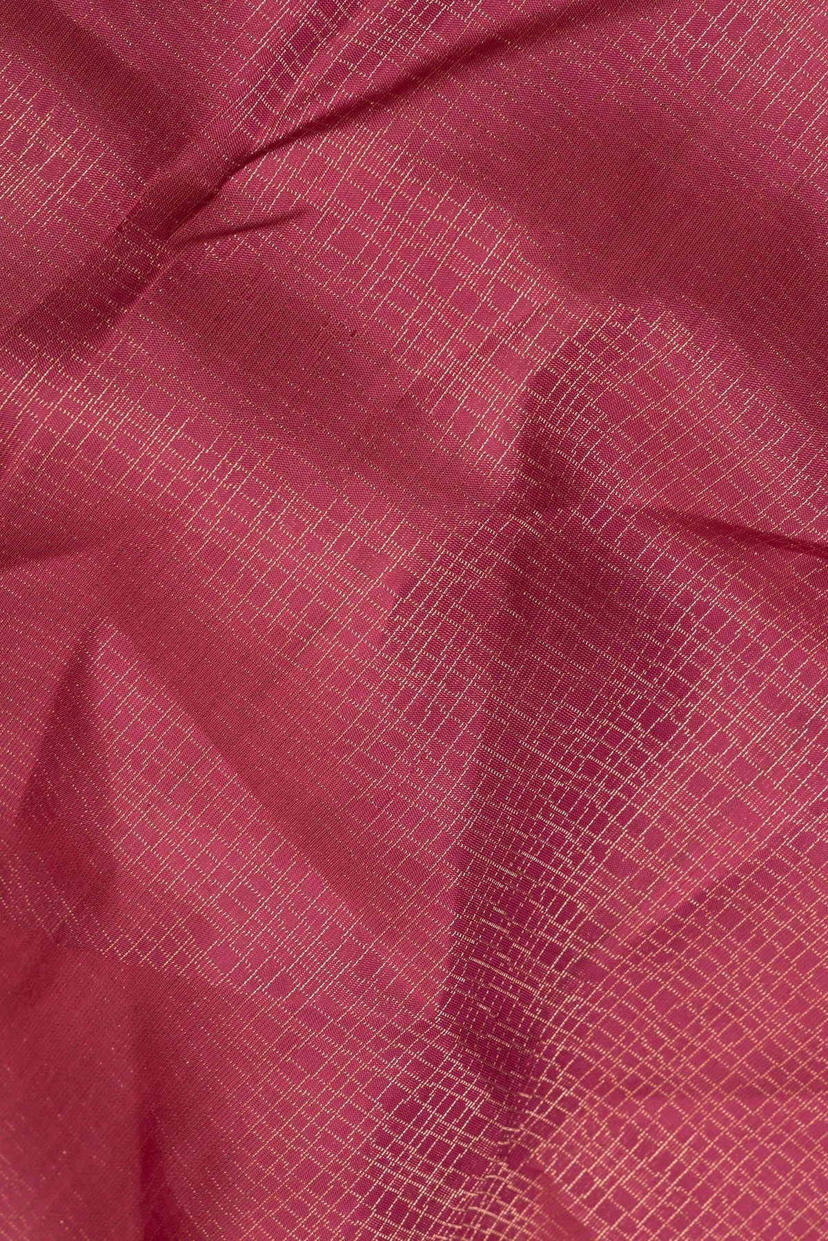 Close up of Pure Silk Coral Soft Saree with Zari Brocade on the body and Fancy Border.  displaying folds