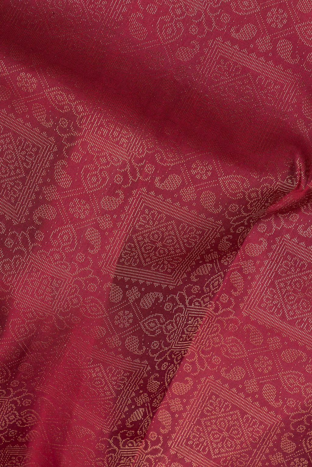 Close up of Pure Silk Maroon Soft Saree with Zari Brocade on the body and Fancy Border.  displaying folds
