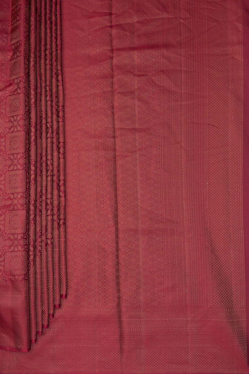 Pleats and pallu of Pure Silk Maroon Soft Saree with Zari Brocade on the body and Fancy Border. 