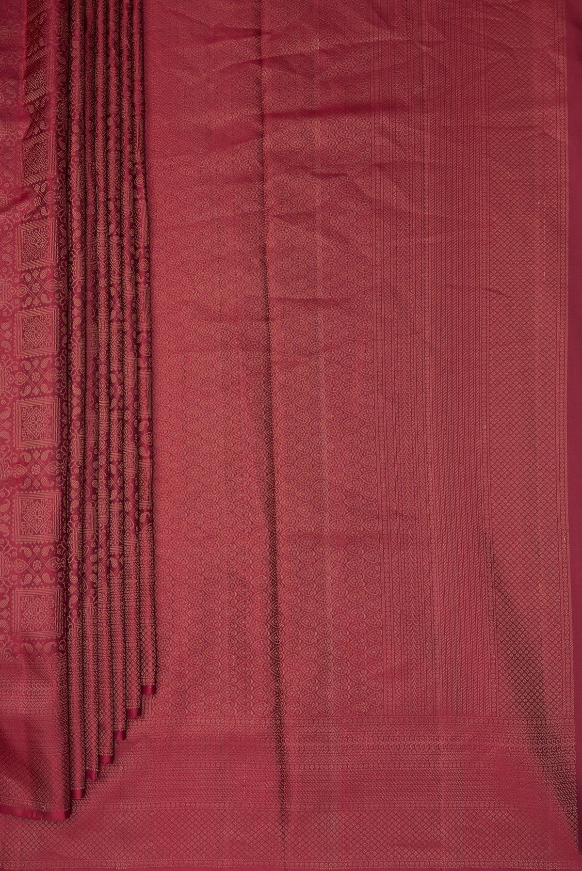 Pleats and pallu of Pure Silk Maroon Soft Saree with Zari Brocade on the body and Fancy Border. 