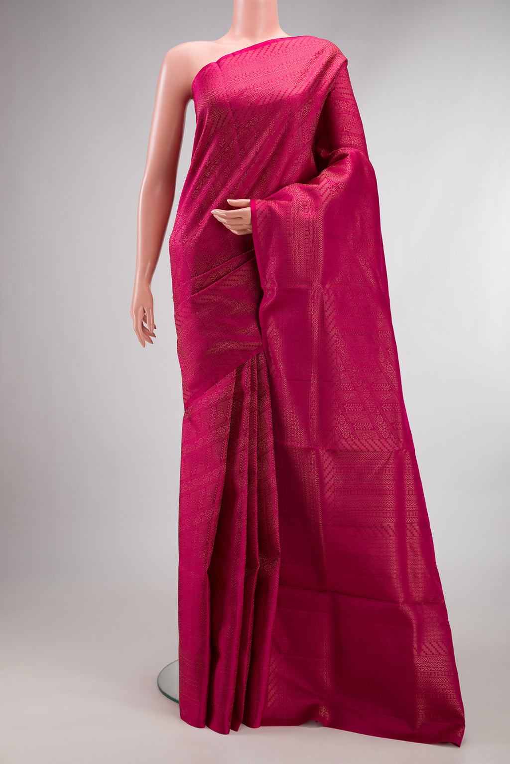 Pure Silk Dark Pink Soft Saree with Zari Brocade on the body and Fancy Border.  displayed on a mannequin