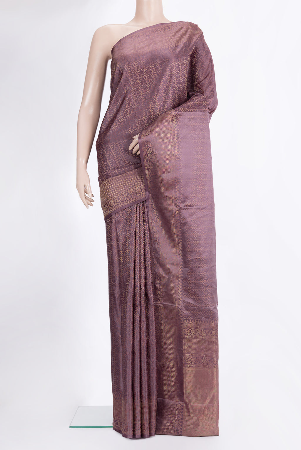 Pure Silk Mauve Soft Saree with Zari Brocade on the body and Fancy Border.  displayed on a mannequin