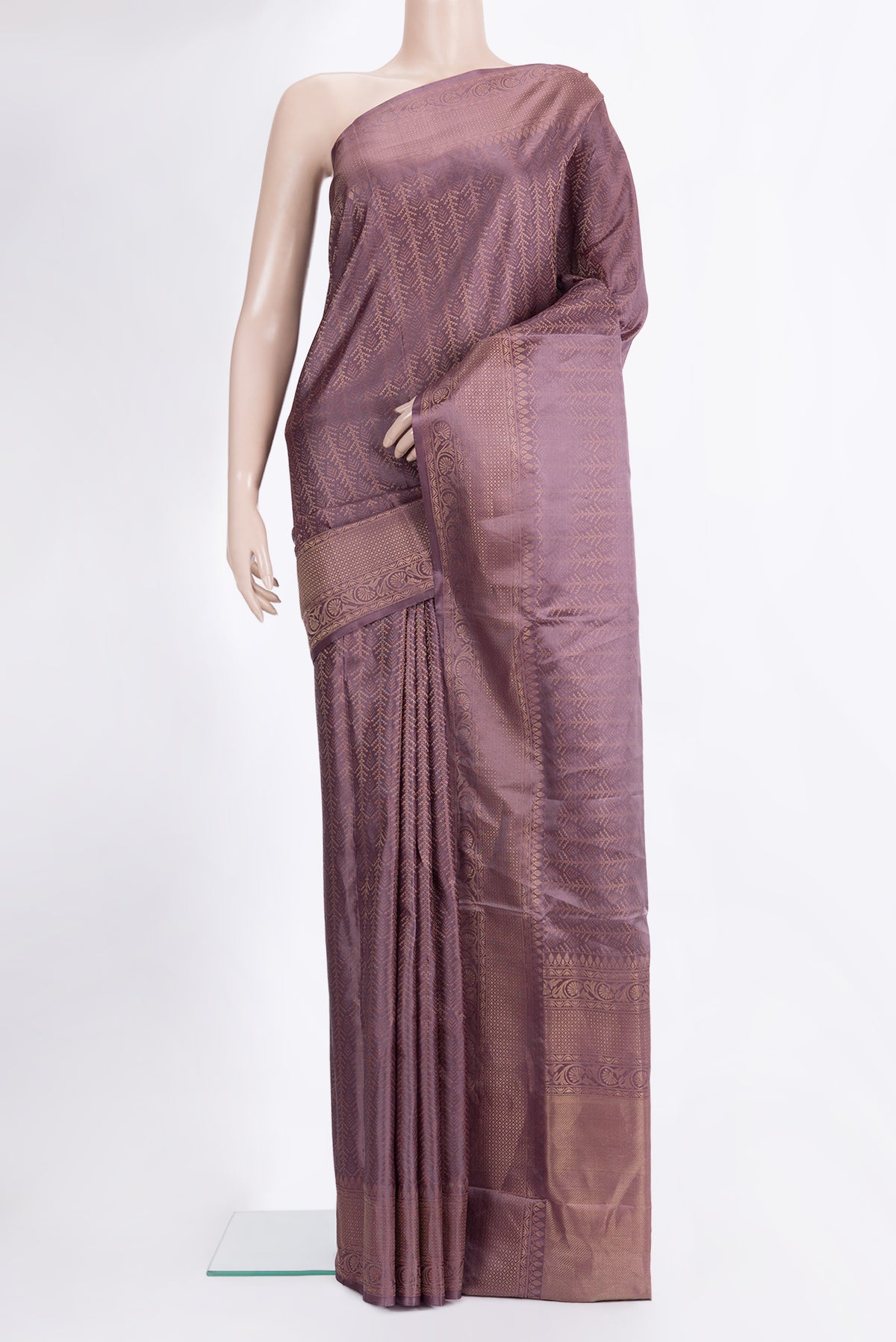Pure Silk Mauve Soft Saree with Zari Brocade on the body and Fancy Border.  displayed on a mannequin